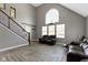 Bright living area with large windows, high ceilings, modern flooring, and comfortable seating at 3015 S Rybolt Ave, Indianapolis, IN 46241