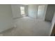 Unfinished bedroom with a window and an open doorway showing flow into other parts of the house at 3297 Godby Dr, Sheridan, IN 46069
