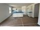 Spacious kitchen with white cabinets, center island, and abundant natural light, ready for customization at 3297 Godby Dr, Sheridan, IN 46069