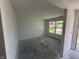 Unfinished room featuring neutral walls, a window and an open doorway creating flow at 3297 Godby Dr, Sheridan, IN 46069