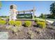 Community entrance sign with landscaping, stone pillar, and a sidewalk entrance at 3303 Godby Dr, Sheridan, IN 46069