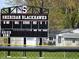 Sheridan Blackhawks scoreboard with visible numbers indicating game progress near a residential area at 3303 Godby Dr, Sheridan, IN 46069