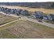New homes line a street with lawns ready for landscaping in a developing neighborhood at 3303 Godby Dr, Sheridan, IN 46069