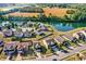 Aerial view of a house in a suburban neighborhood, highlighting its proximity to a pond and green spaces at 3529 Miesha Dr, Indianapolis, IN 46217