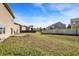 Expansive backyard featuring a green lawn and wooden fence, providing privacy and space for outdoor activities at 3529 Miesha Dr, Indianapolis, IN 46217