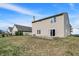 The home's backyard features grass and a sliding door to the house at 3529 Miesha Dr, Indianapolis, IN 46217