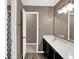 Bathroom featuring double sink vanity, granite counters, and decorative lighting at 3529 Miesha Dr, Indianapolis, IN 46217
