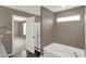 The bathroom features a soaking tub and a glass enclosed shower behind the door at 3529 Miesha Dr, Indianapolis, IN 46217