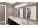 Bathroom features double sink vanity, granite counters, decorative lighting, and view to other rooms at 3529 Miesha Dr, Indianapolis, IN 46217