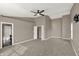 The spacious bedroom has plush carpeting, a ceiling fan, and an ensuite bath at 3529 Miesha Dr, Indianapolis, IN 46217