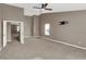 A spacious bedroom features plush carpeting, a ceiling fan, and an open doorway at 3529 Miesha Dr, Indianapolis, IN 46217