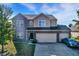 Two-story house featuring a well-maintained lawn and three-car garage at 3529 Miesha Dr, Indianapolis, IN 46217