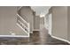 Long neutral hallway features hardwood floors, freshly painted walls, and white trim at 3529 Miesha Dr, Indianapolis, IN 46217