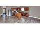 Fully equipped kitchen featuring a kitchen island, and dark wood cabinetry, designed for convenience and style at 3529 Miesha Dr, Indianapolis, IN 46217