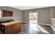 Kitchen with wood cabinets, laminate countertops, a butcher block island and sliding doors to backyard at 3529 Miesha Dr, Indianapolis, IN 46217