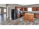 Spacious kitchen featuring a kitchen island, ample cabinet space, and modern appliances for culinary enthusiasts at 3529 Miesha Dr, Indianapolis, IN 46217