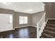 Inviting living room features hardwood floors, freshly painted walls, and bright window at 3529 Miesha Dr, Indianapolis, IN 46217