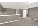 Loft space features neutral walls, carpet and access to other rooms at 3529 Miesha Dr, Indianapolis, IN 46217