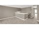 A well-lit loft space with neutral walls and carpet at 3529 Miesha Dr, Indianapolis, IN 46217