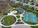 Overhead shot of community park featuring tennis courts, playground, walking paths, and picnic pavilion among landscaped greenery at 3650 Tipperlin Rd, Bargersville, IN 46106