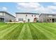 Expansive backyard featuring a well-maintained lawn, play set, and outdoor seating area, perfect for recreation and relaxation at 3650 Tipperlin Rd, Bargersville, IN 46106