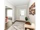 Bright entryway featuring wood floors, a decorative rug, and a white front door at 3650 Tipperlin Rd, Bargersville, IN 46106
