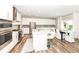 Modern kitchen featuring white cabinets, stainless steel appliances, and a large center island at 3650 Tipperlin Rd, Bargersville, IN 46106
