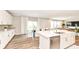 Open concept kitchen and dining area with stainless steel appliances and wood flooring at 3650 Tipperlin Rd, Bargersville, IN 46106