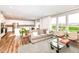 Spacious living area with hardwood floors, large windows, and open-concept layout at 3650 Tipperlin Rd, Bargersville, IN 46106