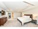 Spacious main bedroom with tray ceiling, carpet, and multiple windows providing lots of natural light at 3650 Tipperlin Rd, Bargersville, IN 46106