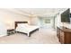 Spacious main bedroom with tray ceiling, carpet, and multiple windows providing lots of natural light at 3650 Tipperlin Rd, Bargersville, IN 46106