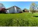 Expansive backyard featuring a spacious lawn and mature landscaping, perfect for outdoor activities at 3730 Cheyenne Ct, Columbus, IN 47203