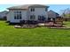 Large backyard with lush lawn with deck and patio at 3730 Cheyenne Ct, Columbus, IN 47203