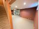 Basement with neutral carpeting and a view of additional space, offering versatile living options at 3730 Cheyenne Ct, Columbus, IN 47203