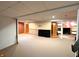 Partially finished basement with carpet and access to a finished bonus room at 3730 Cheyenne Ct, Columbus, IN 47203