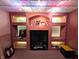 Finished basement with built-in shelving, fireplace, and recessed lighting at 3730 Cheyenne Ct, Columbus, IN 47203