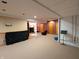 Open basement layout with carpeted flooring and easy access to additional rooms at 3730 Cheyenne Ct, Columbus, IN 47203