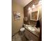 Cozy bathroom with decorative wall art, single sink, and a toilet at 3730 Cheyenne Ct, Columbus, IN 47203