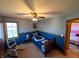 Comfortable bedroom with a Colts-themed bed and soft natural lighting, great for a relaxing space at 3730 Cheyenne Ct, Columbus, IN 47203