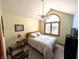 Vaulted bedroom with ceiling fan, arched window and a light color scheme at 3730 Cheyenne Ct, Columbus, IN 47203
