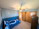 Well-organized bedroom with a Colts-themed bed and ample closet space, offering a cozy retreat at 3730 Cheyenne Ct, Columbus, IN 47203