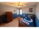 Stylish bedroom with a Colts-themed bed, fan, and natural light, perfect for a sports enthusiast at 3730 Cheyenne Ct, Columbus, IN 47203