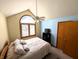 Bright bedroom with arched window, ceiling fan and walk-in closet at 3730 Cheyenne Ct, Columbus, IN 47203