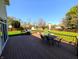 Relaxing deck with grill and outdoor dining, overlooking expansive fenced yard at 3730 Cheyenne Ct, Columbus, IN 47203