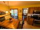 Inviting dining room with a wooden table, chairs, and sliding glass doors leading to the backyard at 3730 Cheyenne Ct, Columbus, IN 47203