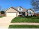 Charming single-Gathering home with a brick facade, well-manicured lawn, and attached two-car garage at 3730 Cheyenne Ct, Columbus, IN 47203