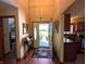 Bright foyer featuring hardwood floors and an open view to the kitchen at 3730 Cheyenne Ct, Columbus, IN 47203