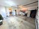 Garage view showcasing door to dining room, storage options and an automatic overhead door opener at 3730 Cheyenne Ct, Columbus, IN 47203
