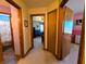 Well-lit hallway connecting multiple rooms, providing easy access throughout the home at 3730 Cheyenne Ct, Columbus, IN 47203
