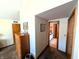 Hallway showcasing a dresser and a bathroom at 3730 Cheyenne Ct, Columbus, IN 47203